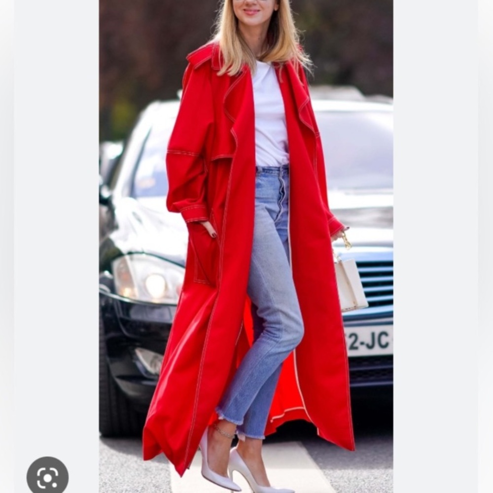 Red vintage trench coat with silver snap buttons and matching belt. Lined size M